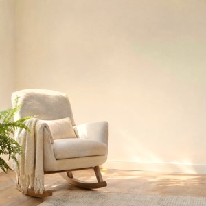 An empty rocking chair in morning light.